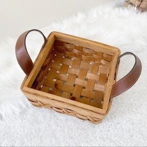 Small brown wicker basket w/ faux leather handles